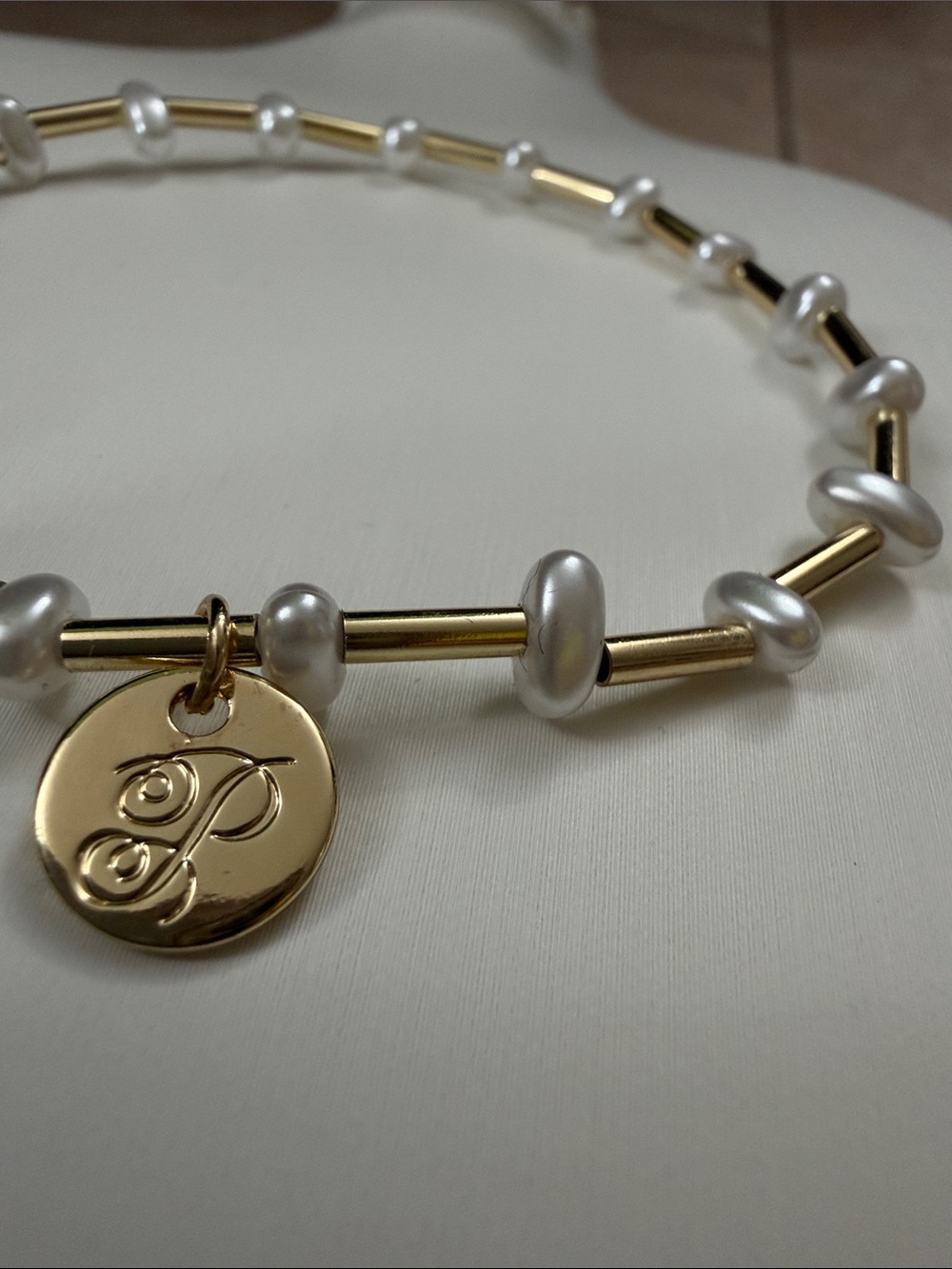 Plunder Gold Tone and White Pearl Stretch Bracelet with Logo Charm - Picture 2 of 4